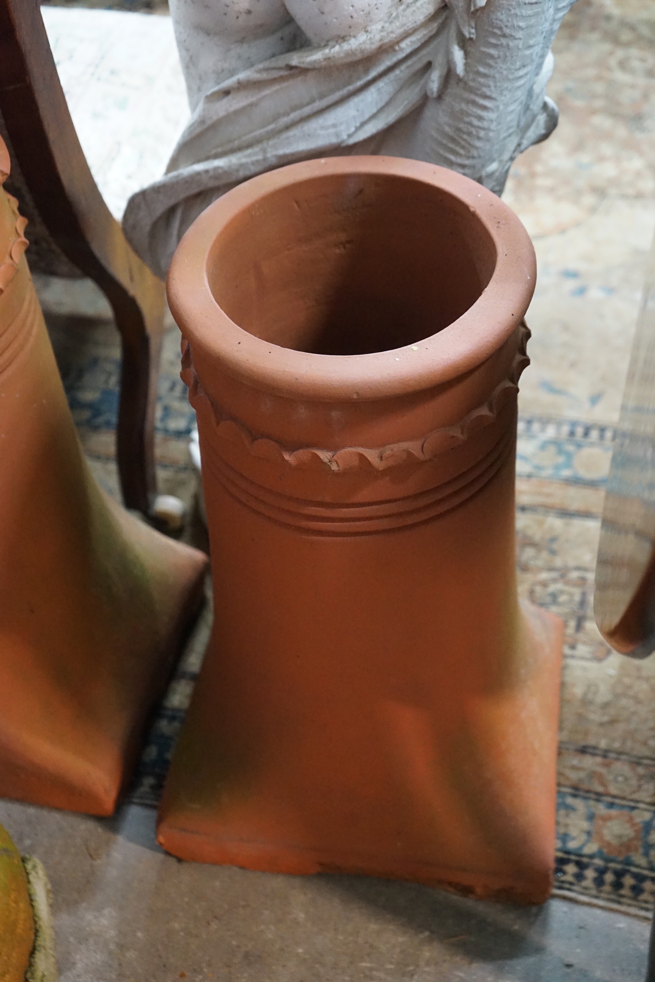 Three terracotta chimney pots, largest height 62cm